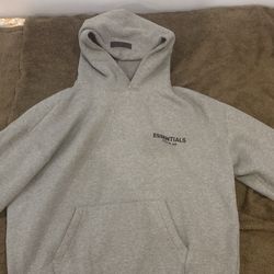 Size Large grey oatmeal essential hoodie good condition feels great on body