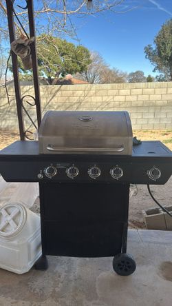 Nexgrill 4-Burner Propane Gas Grill in Black with Side Burner and Stainless Steel With Gas Cylinder Included