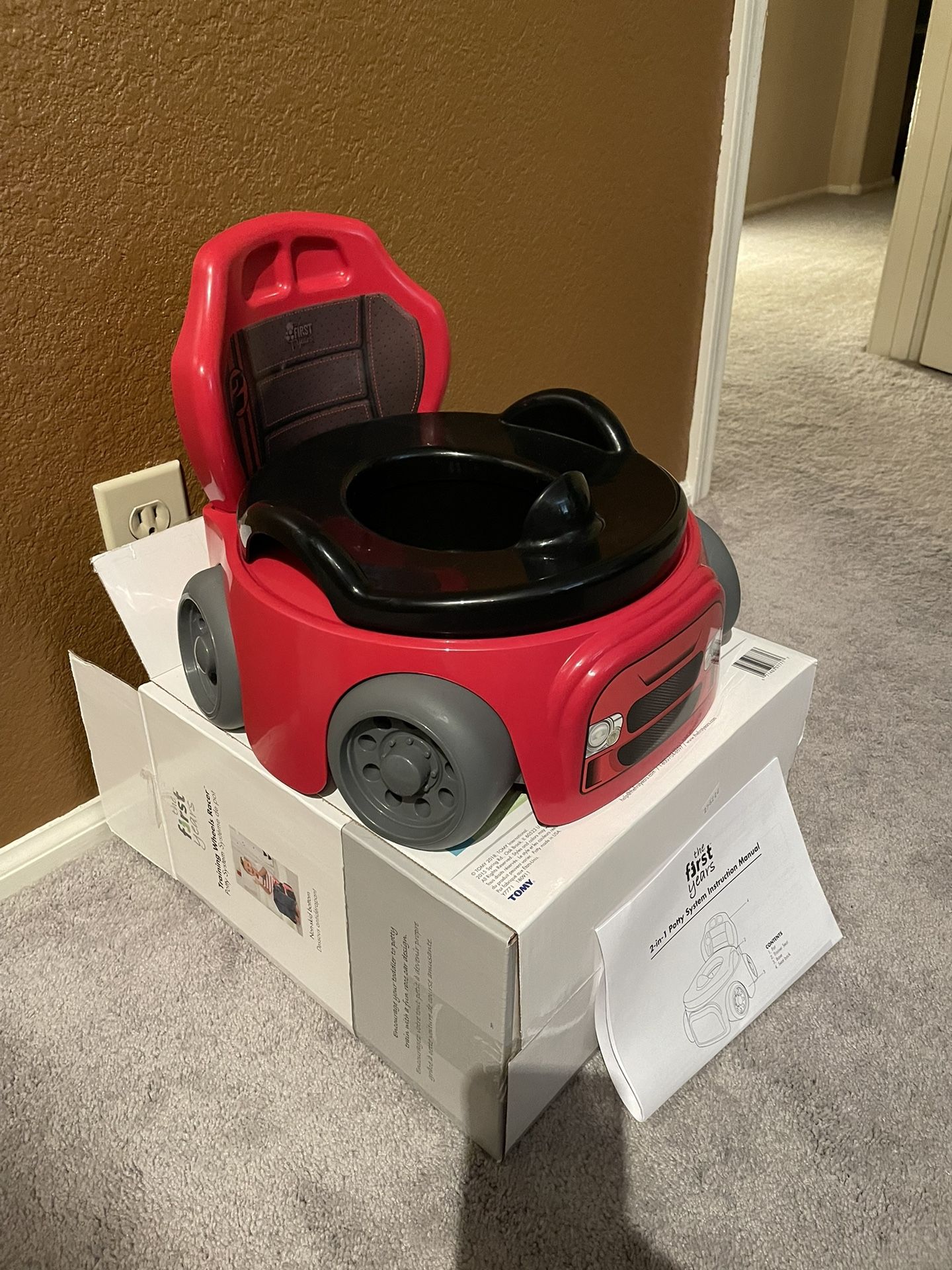 The First Years Training Wheels Racer Toddler Potty Training Toilet - Race Car Potty Training Potty - Includes Detachable Toddler Toilet Seat and Kids