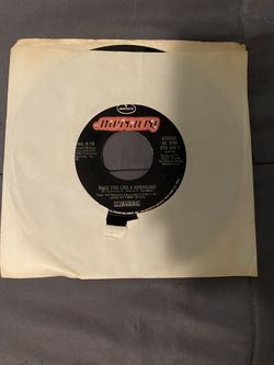 Scorpions 45 Rpm Vinyl ( Rock You Like A Hurricane & Coming Home) 