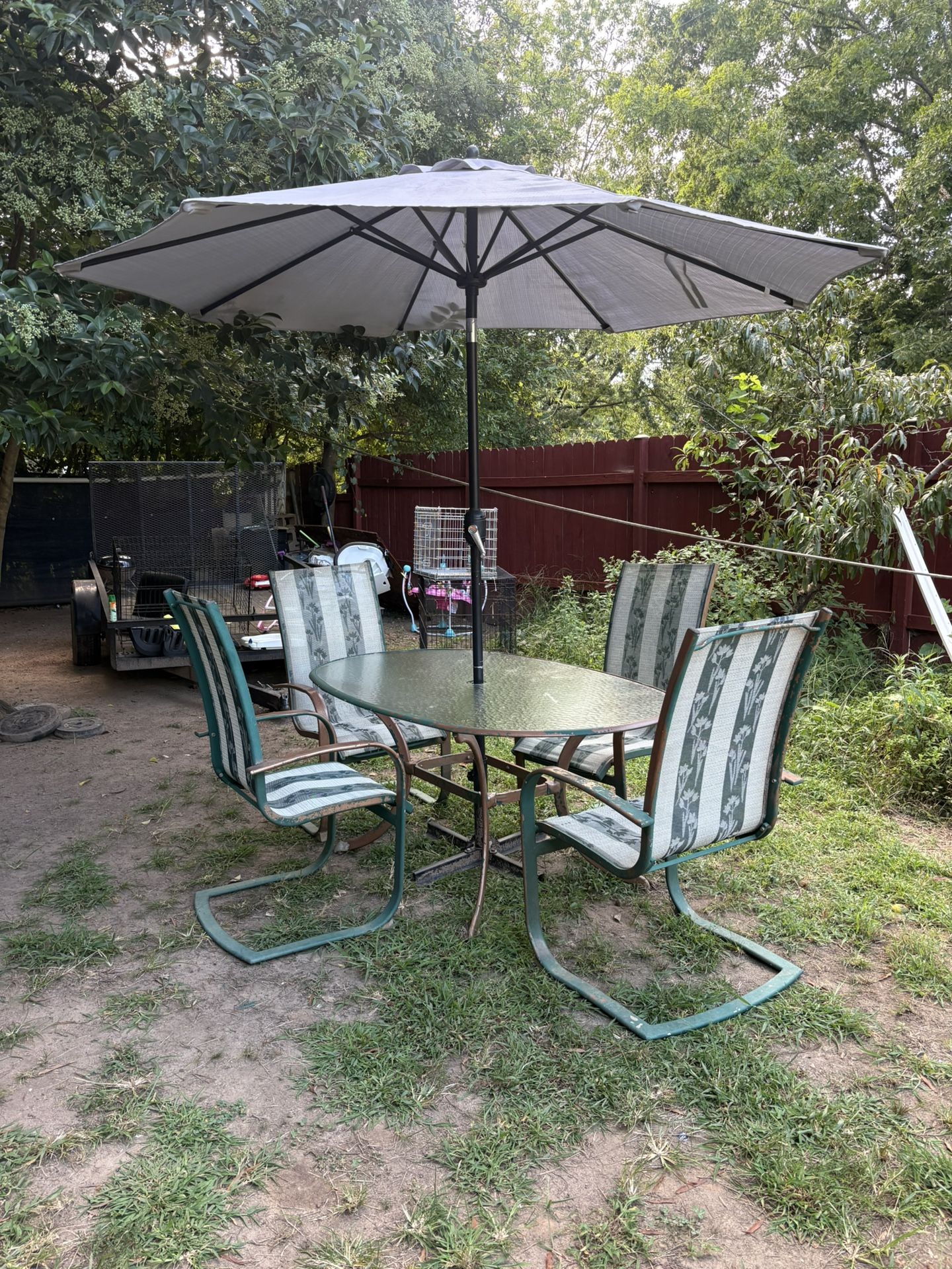 Table And Chairs And Umbrella