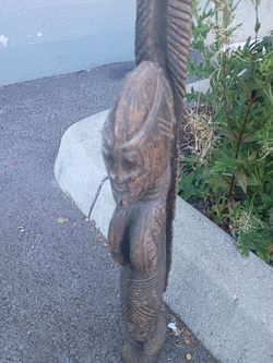 HAND CARVED FIGURE.