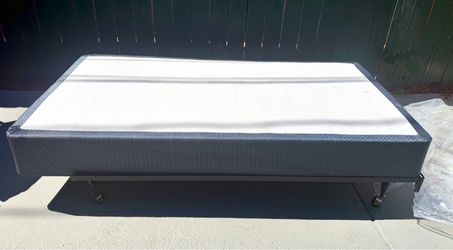Amazing set of a Twin brand-new Sealy box spring and a barely used adjustable metal bed frame!