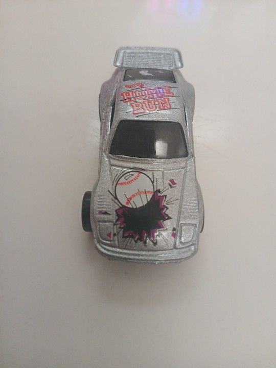1989 Hot Wheels Silver Baseball Porsche 930 Home Run diecast car.