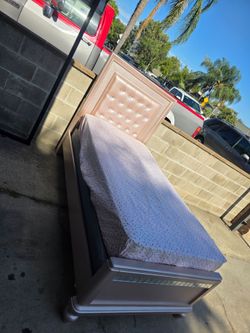 Twin bed with base board and mattress