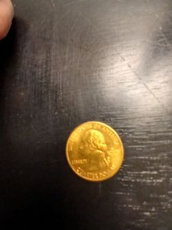 Gold-Toned US Quarter Dollar Coin