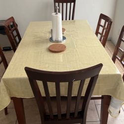 A Nice Wood Dining Table With 6 Chairs 