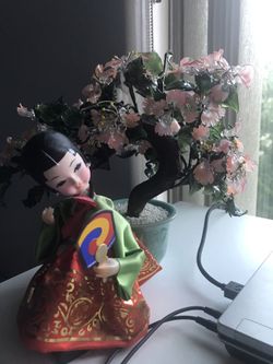 japanese doll and glass cherry blossom tree