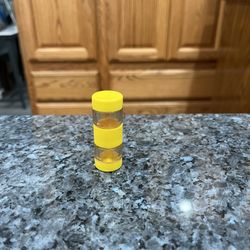 Vintage Cylindrical Yellow Screw Together 1950s Picnic Salt and Pepper Shakers.  Size appropriately 2 1/4 inches tall.   Preowned. 