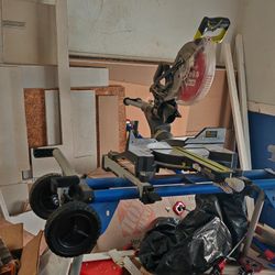 Hercules 12 in. Dual-Bevel Sliding Compound Miter Saw mounted on a mobile stand. And Included Stand