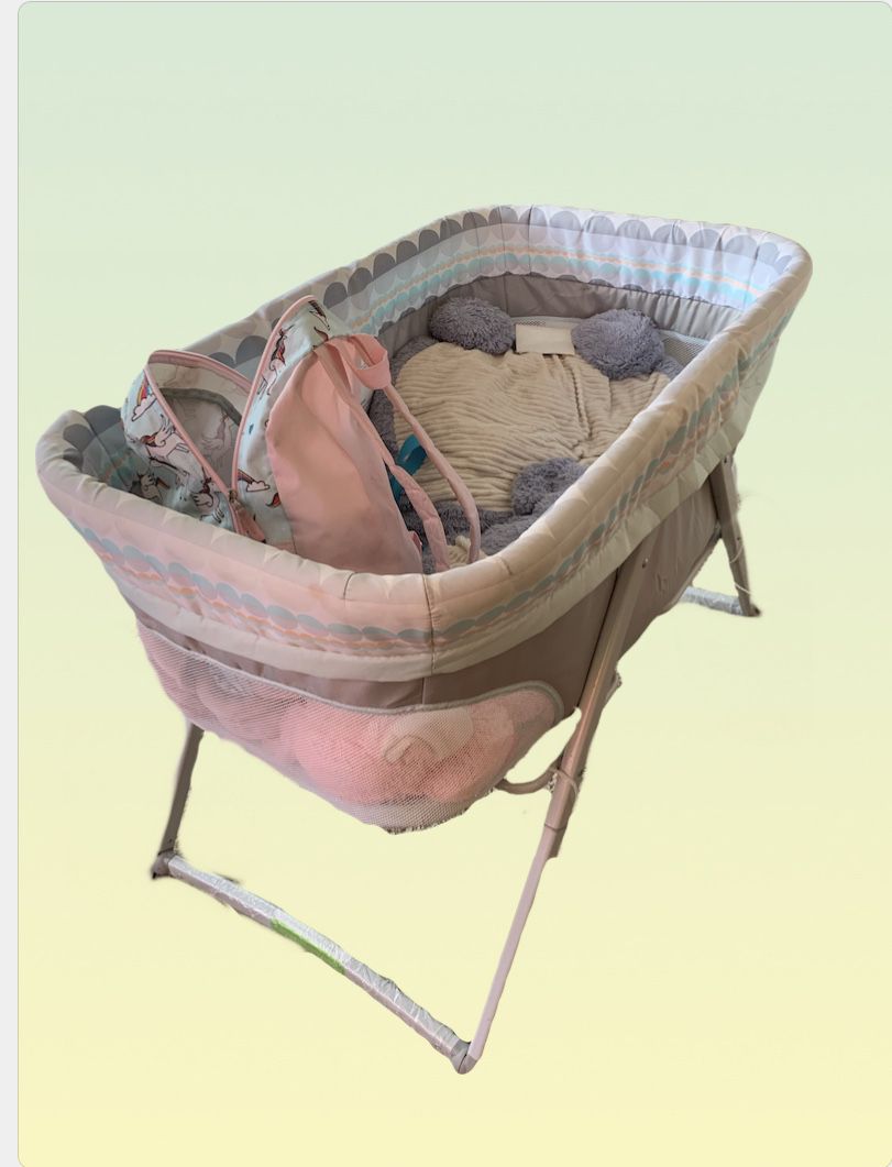Fold up rocking bassinet and diaper changing table with storage drawer
