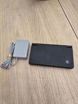 $110 - Nintendo DSi Black w/ Charger, Stylus, 4GB SD Card & Digital Games