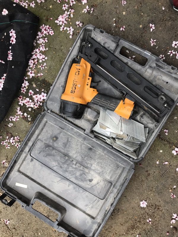 Bostitch nail gun with original box and nails