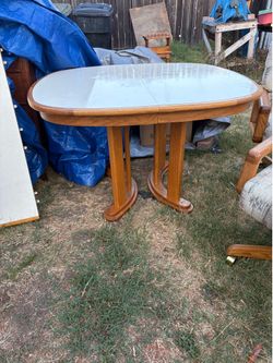Dining Table with additional leaf and four chairs