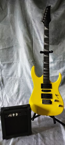 Brand new electric guitar with new 10 watts amp bag cable and shoulder strap