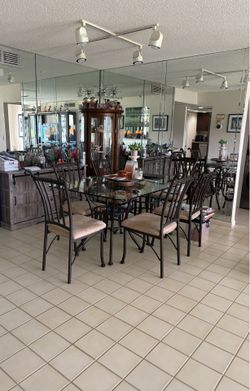 Dining room table with padded chairs