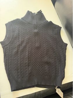 Black sleeveless sweater Vest.  Size XL