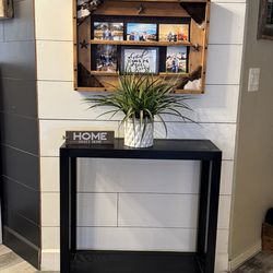 Black console table with shelf