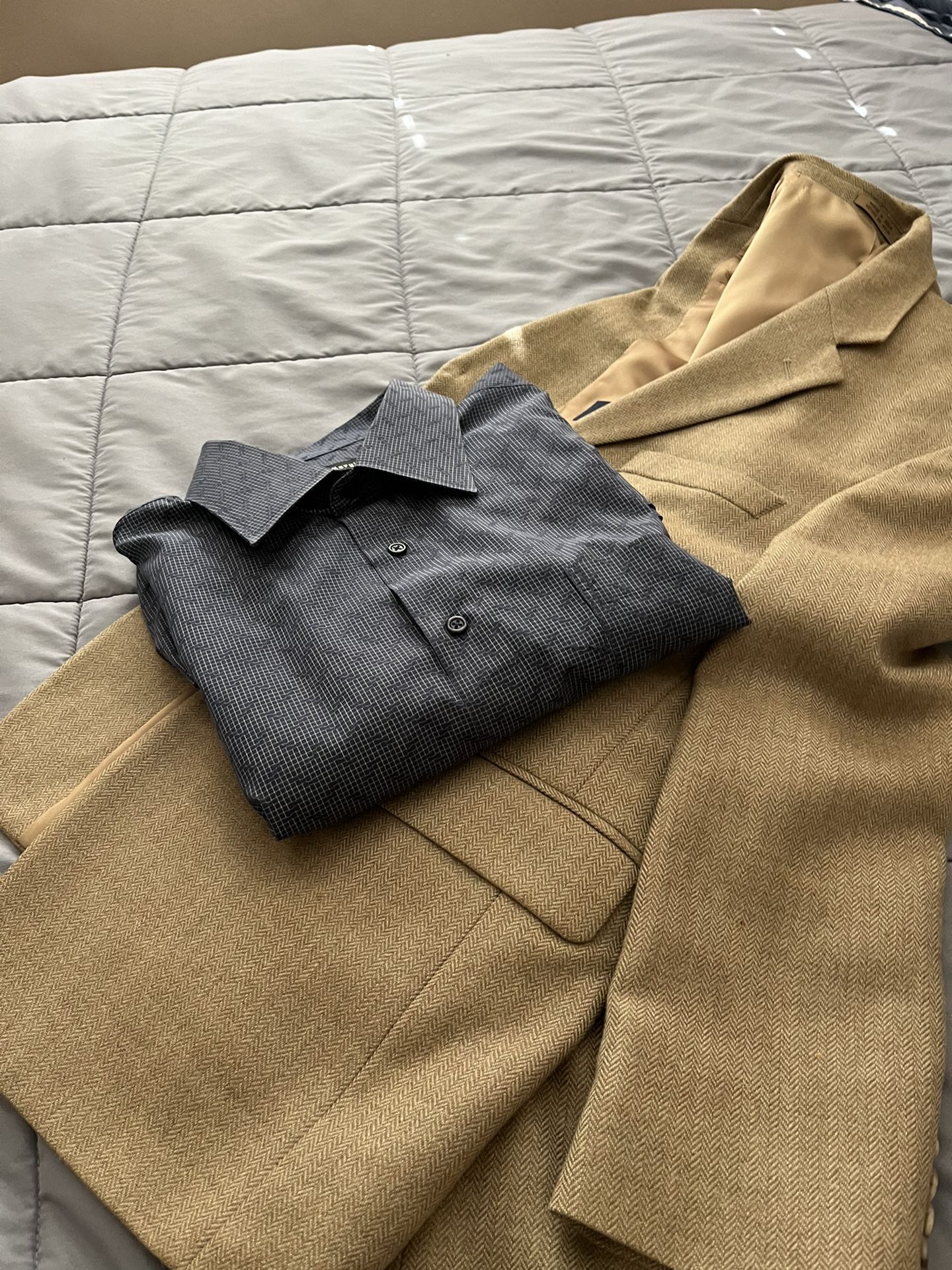 There Is Two Pieces A Jacket in size 38 the color Is Camel and a shirt and size large classic fit the color is blue There For Man’s Both For $40 Total