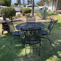 Wrought Iron Patio Set 54” Table and Four Chairs in Satin Black Finish Very Solid In Excellent Condition 