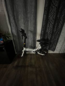 Electric Scooter with Seat Attachment