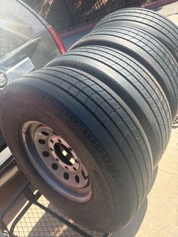 (4) used 235/85/16 —Goodyear G614 Rst 14 ply tires on 8 lug wheels $499 for the set  over 85% tread