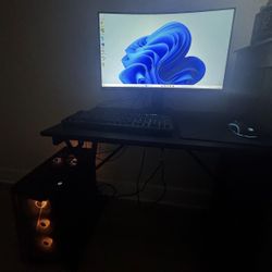 A PC GAMER AND MONITOR INCLUDED WITH KEYBOARD AND MOUSE 