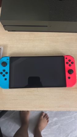 Nintendo Switch with Neon Joy-Cons with 2 Mario games