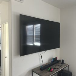 Samsung 75” 4K LED TV (Includes Sound Bar And Woofer As Well As Mounting Hardware).