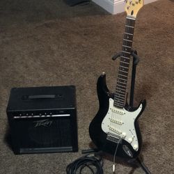 Peavey Guitar, amp, cable , and stand 