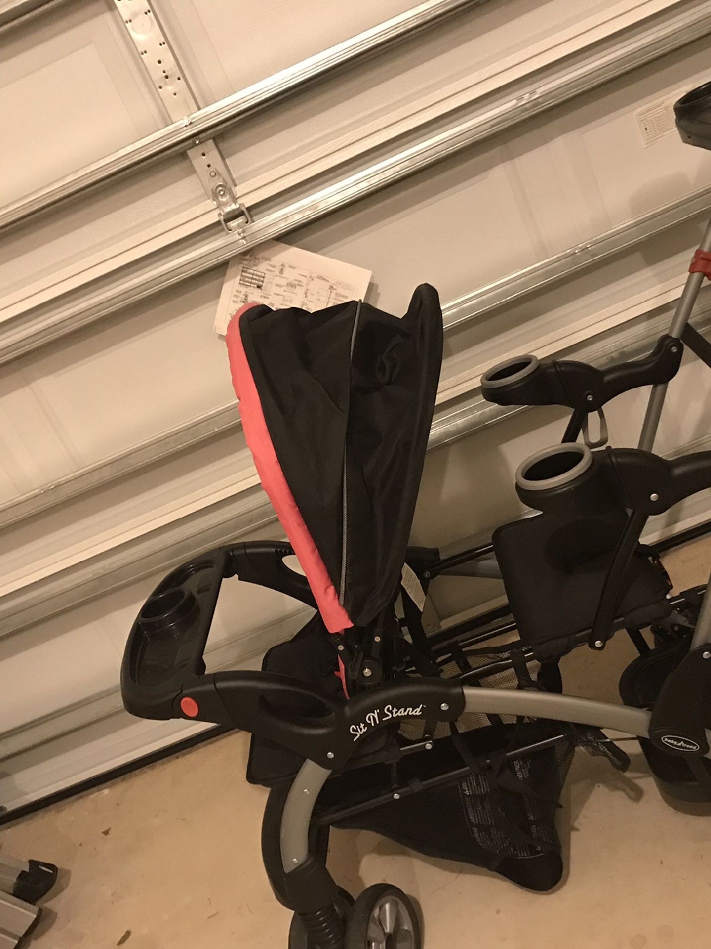 Pink and black sit&stand double stroller