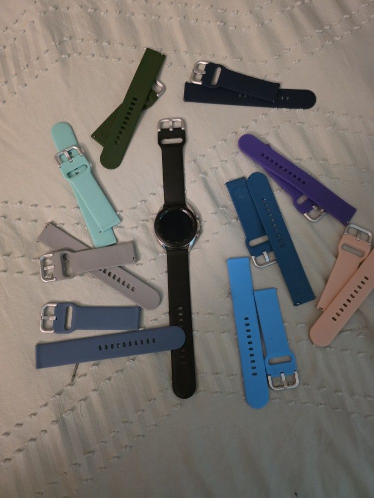 Samsung 3 watch plus charger and bands.