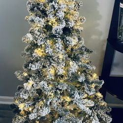 5 Foot Pre-Lit Flocked Christmas Tree $40