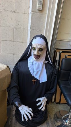 Life size demonic nun Halloween prop