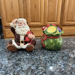 Vintage Ceramic Santa Claus and Toy Gift Sack Bag Pair of Salt and Pepper Shakers .  Size approximately 4 inches tall Santa.  Preowned never used.  Ha