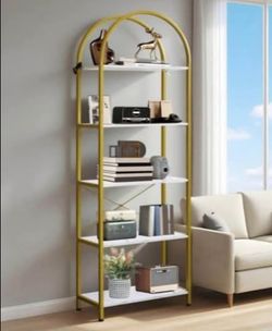 Modern 5-tier shelving unit has a gold-finished metal frame with an arched top design. The shelves are made of wood with a white marble-patterned lami