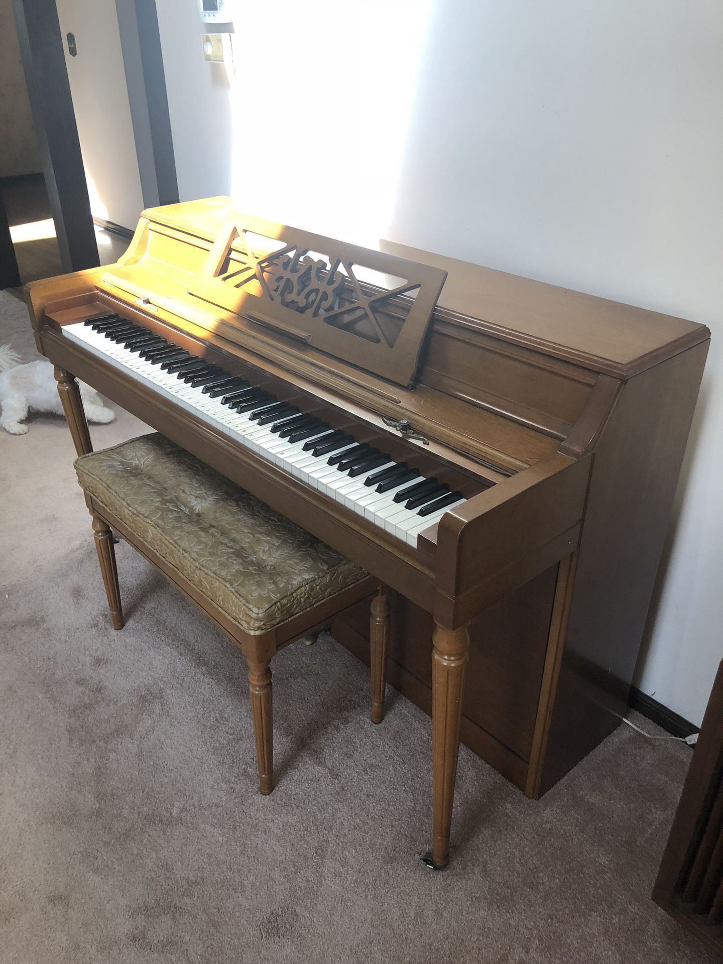 Vintage piano with seat