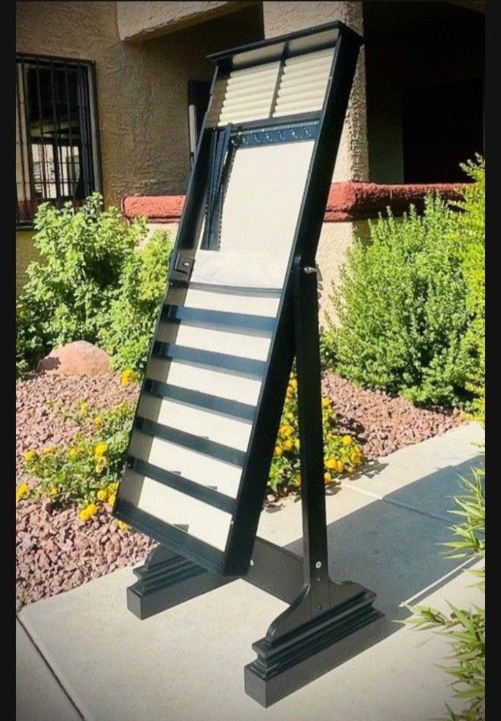 JEWELRY STAND. WOODEN FRAME. FRAME SIZE: 62" X 19.75". DEPTH OF THE BASE: 16.5".