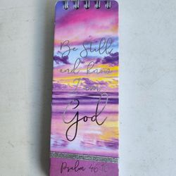 Small spiral-bound notebook or journal