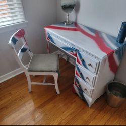 Custom painted patriotic desk And chair with shotgun shell handles.