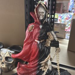 ESTATUA DE LA SANTA MUERTE QUEBRADA DE UN BRAZO
