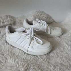 White Adidas trainers with a sporty vibe