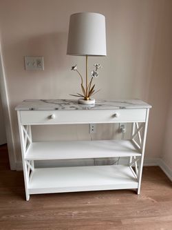 Console with marble top and flower lamp