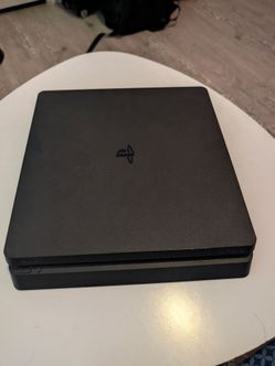 PlayStation 4 slim with 2 original controllers