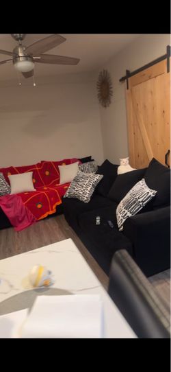 Black couches w pillows
