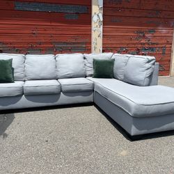 Ashley’s Gray Sectional Sofa Couch with right facing chaise