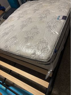 Queen sized platform bed with mattress