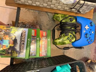 Two Xbox controllers 3 xbox games Minecraft, the incredibles and the hobbit