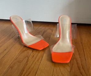 Clear strap heels with orange accents