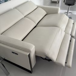 Atlas White Leather/Vinyl Power Reclining Sofa Loveseat Excellent Condition. Adjustable Headrest / Footrest. Dimensions: 63W x 33H x 43.5L. Was $2,400
